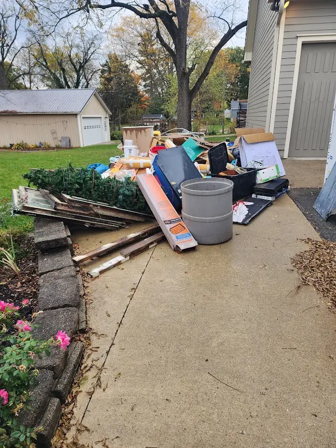 Dumpster being loaded with debris for 30 Yard Dumpster Rental in Marietta
